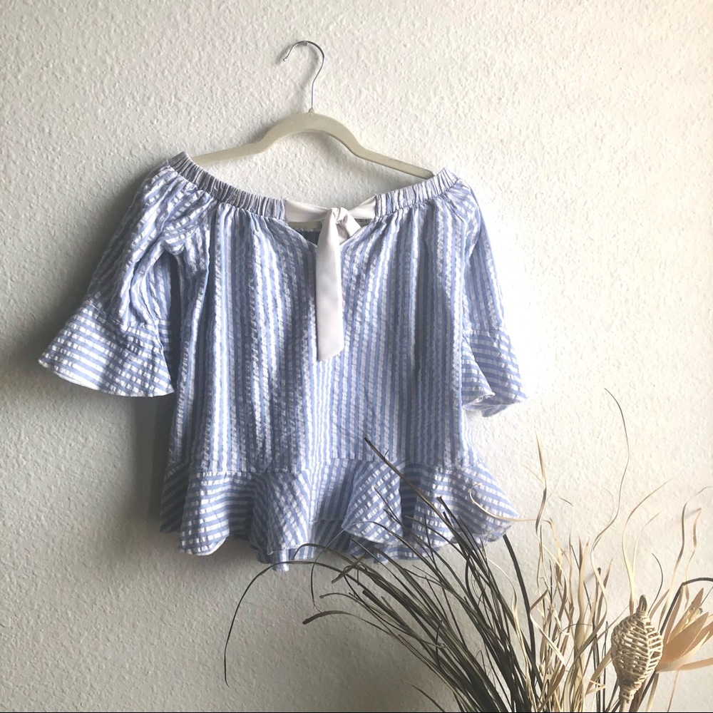 Off shoulder white and blue stripe peplum top